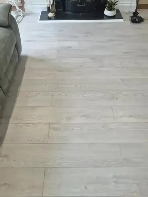 Pale wood-effect flooring in a furnished living room
