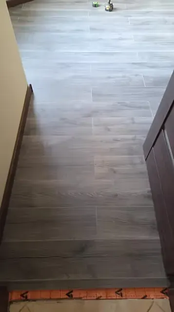 Grey wood-effect flooring in a room