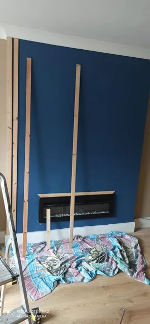 Timber battens and trim preparation for a fireplace feature wall