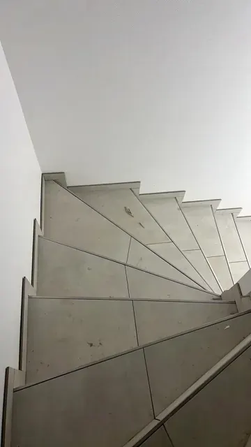 Tiled treads on a spiral staircase