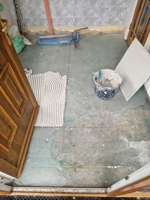 A floor being prepared before tile installation