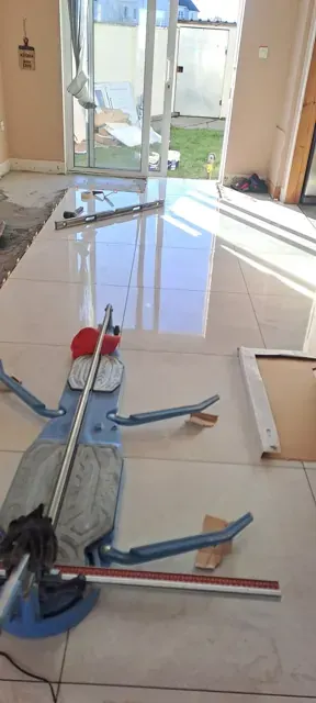 Large polished floor tiles during fitting